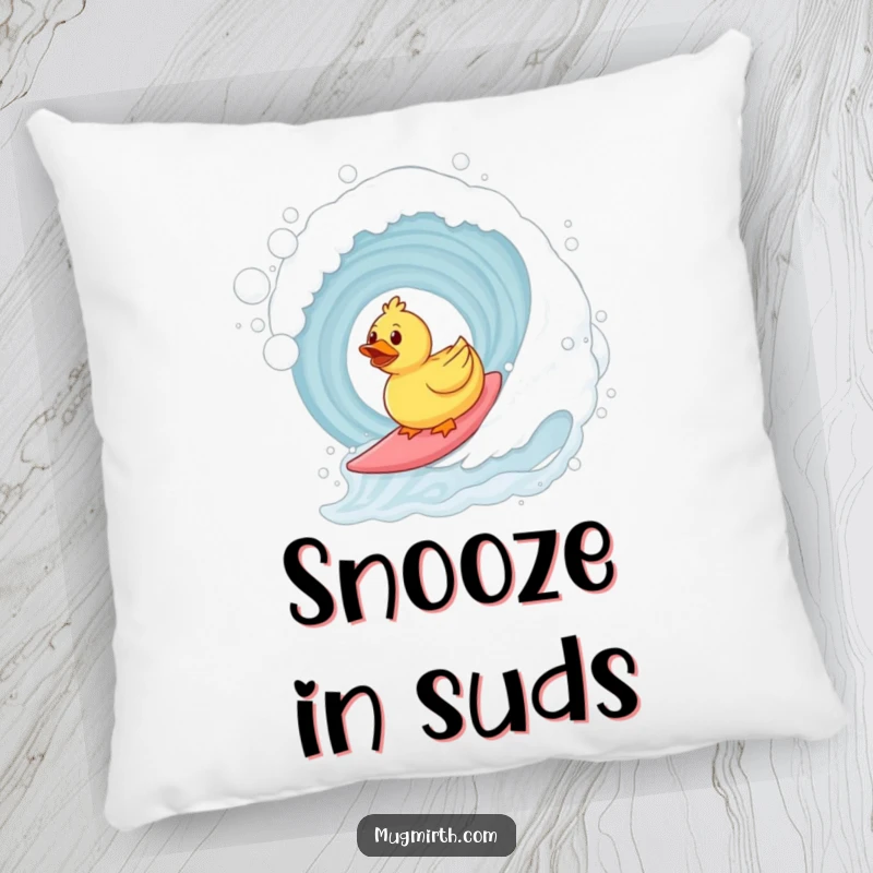 Funny surfing rubber duck pillow featuring a duck riding a bubble bath wave. Soft and humorous decorative item.