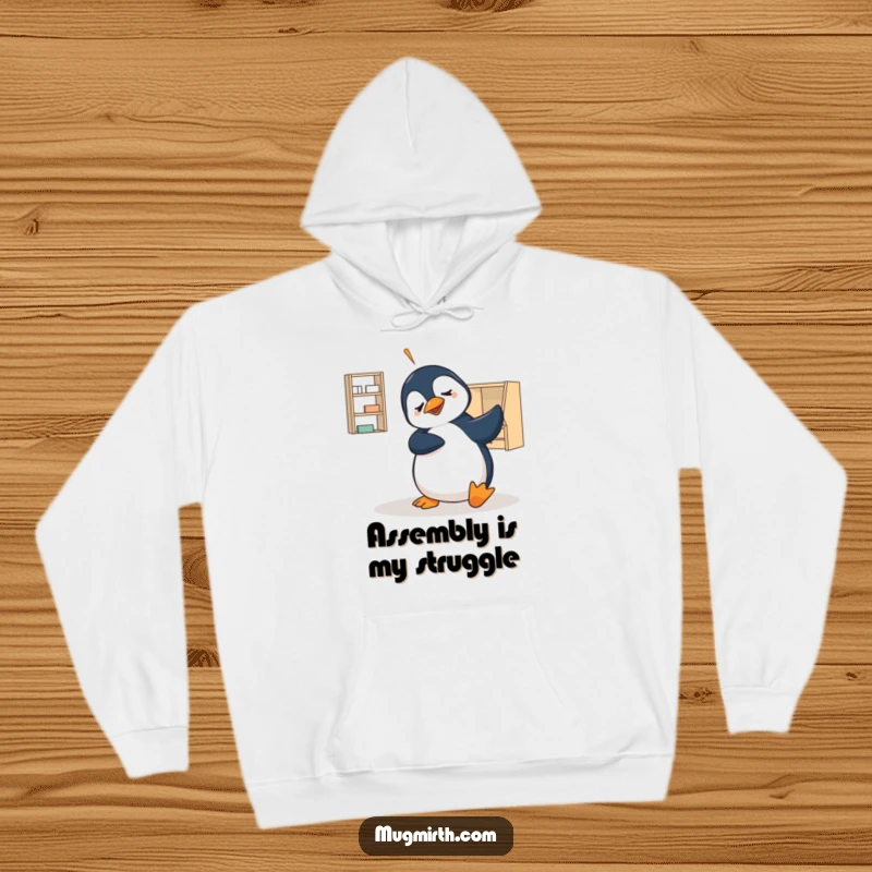 Funny hoodie featuring a bewildered penguin comically failing at flat-pack furniture assembly, a warm and humorous gift for any occasion.