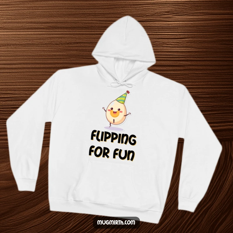 Funny hoodie depicting a smiling egg in a party hat attempting a cartwheel, offering warmth and humorous charm, a great gift.