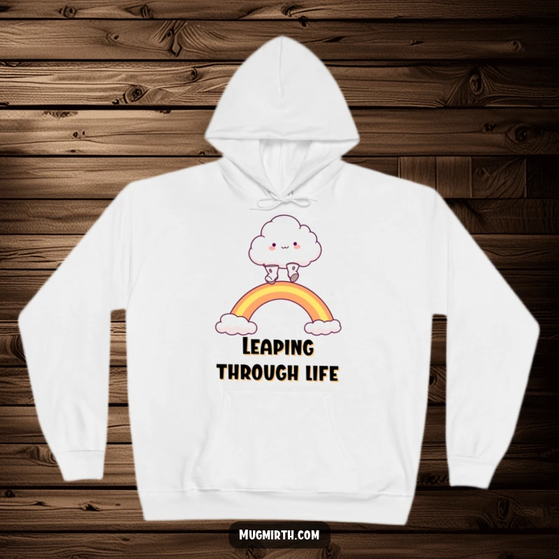Funny fluffy cloud character in little boots, leaping joyfully over a rainbow, offering warmth. A cozy and funny hoodie.
