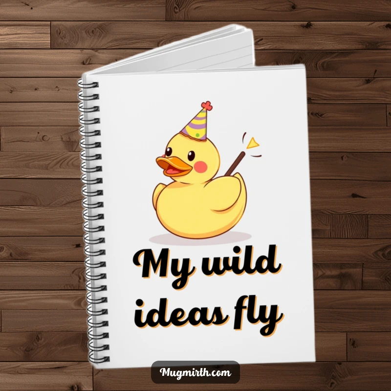 Funny notebook cover: a rubber duck in a party hat is launched from a slingshot, inspiring playful notes.