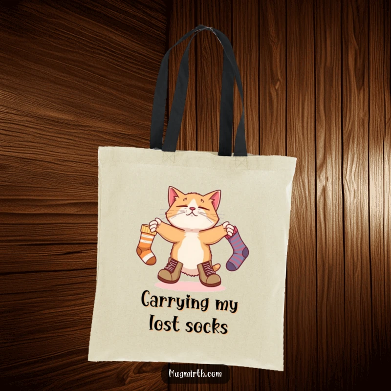 Funny tote bag with a bewildered cat wearing boots, juggling socks, showcasing a humorous and relatable scene.